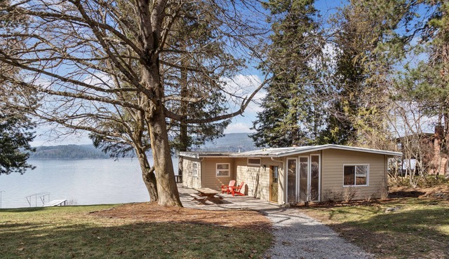Rustic lakefront retreat with private beach, dock & large deck - dog-friendly