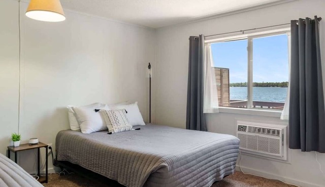 Rustic lakeside condo on Fife Lake with fully equipped kitchen and balcony