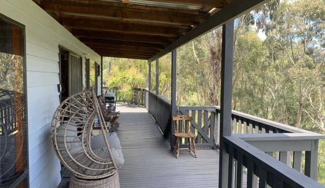 Rustic log cabin perched high on Goughs Bay