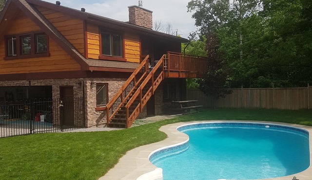 Rustic luxury chalet with fenced yard and pool, walk to beach and playground