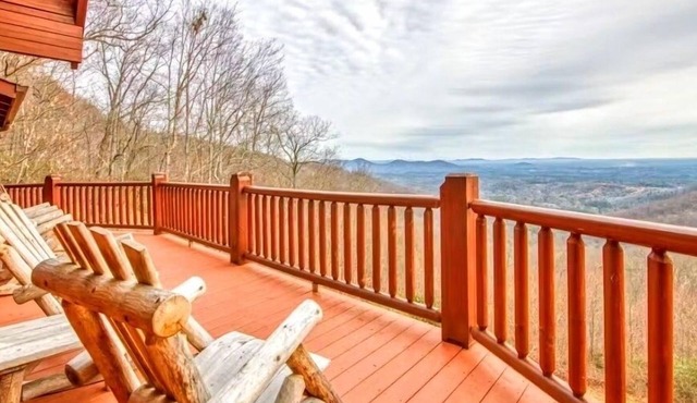 Rustic mountain-view home with deck, fire pit, hot tub, fireplace, & game room
