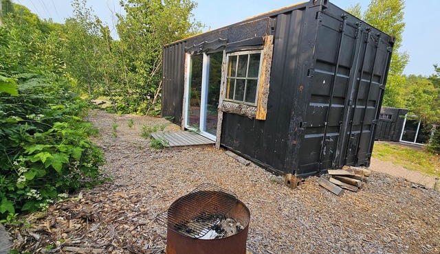 Rustic shipping containers made into cozy cabins. Located U.P.'s Copper Country.