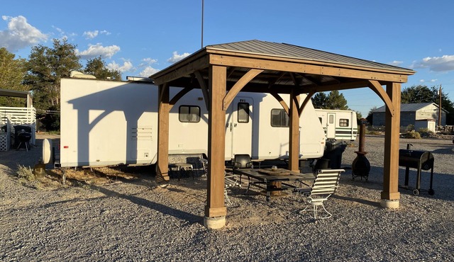 RV1 Camper privacy of your own with 50 amp EV charging outlet available.