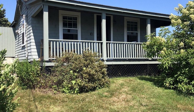 Sakonnet Point water view cottage with 8 minute walk to idyllic private beach .