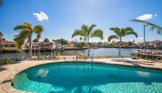 Saltwater canal front 4 bedroom tropical home with private pool and boat dock