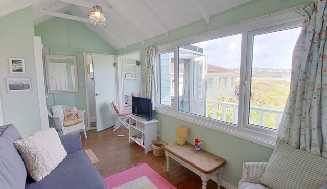 Sandford is a charming, traditional beach chalet, with great sea views.