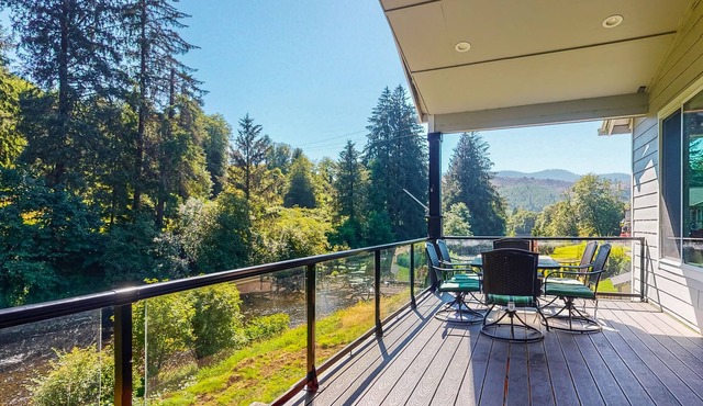 Scenic river-view retreat with patio, firepit, deck, grill, & game room