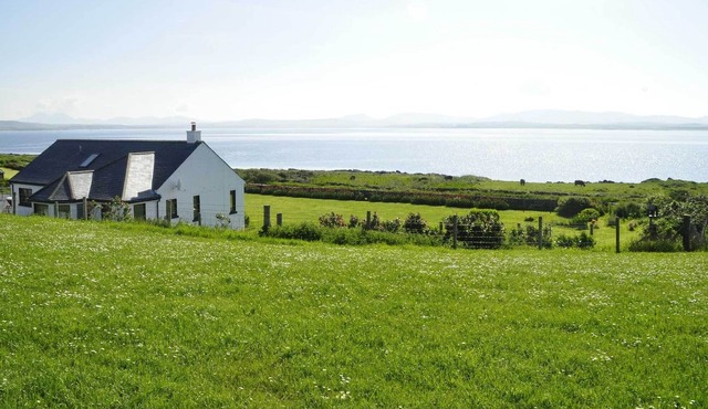 Sea front family home, large garden, close to Port Charlotte, sleeps up to 8.