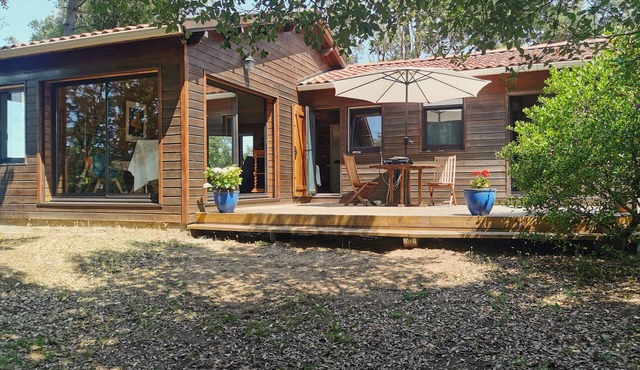 Sea-view house with large terrace and wooded grounds.
