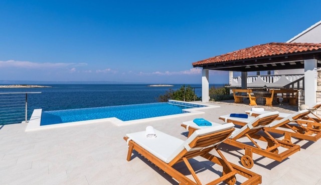 Seafront Villa Mijo by Villas Guide