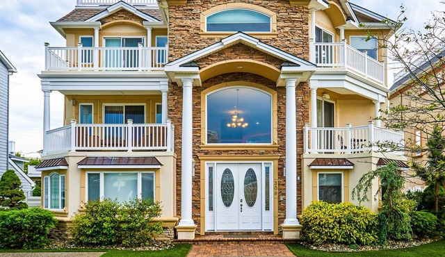 Seaside Beach Mansion w/9 Bedrooms, 8 Full Baths, Pool, Elevator & Rooftop Deck.