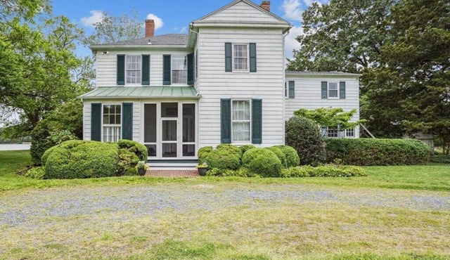Secluded 1870s farmhouse full of historic charm + breathtaking waterfront views!