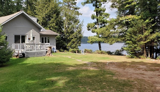 Secluded 2 acre Lakefront Home with boat and motor included on 5 lake chain.