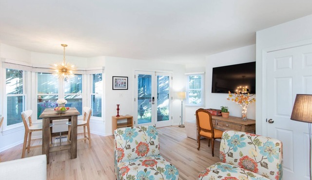 Secluded garden apartment nestled between two Victorians