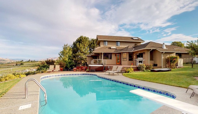 Secluded getaway with lake view, private hot tub, seasonal pool & spacious yard