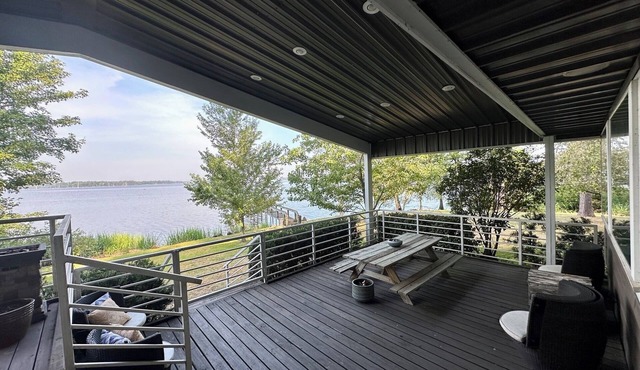 Secluded getaway with lakefront views. Spacious covered deck and dock access.