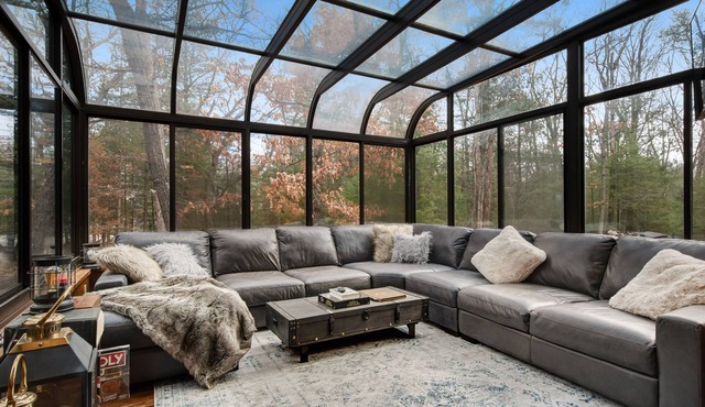 Secluded home near the lake with huge sunroom, firepit, gas grill, & private W/D