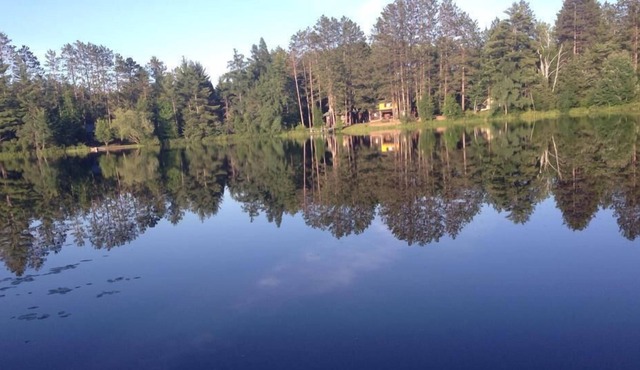 Secluded lake cabin on 2 acres with swimming beach, dock & sauna, new roof