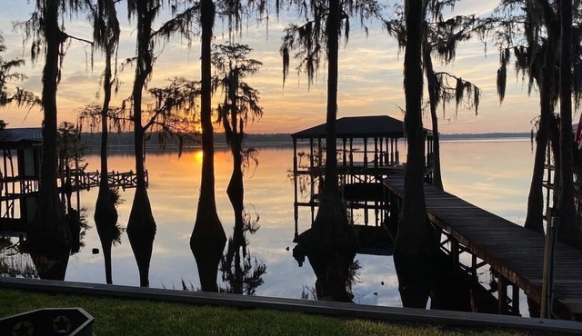 Secluded lake front w/private dock, boat lift, large screened porch