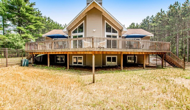 Secluded lake retreat with game room; near beach, boat rental, dining, and golf