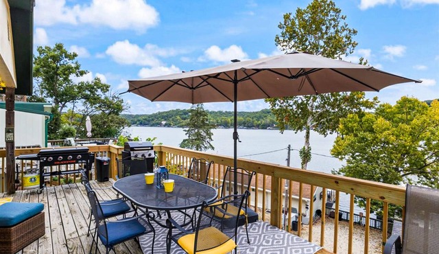 Secluded lakefront home with dock, fire table, lake views, & streaming