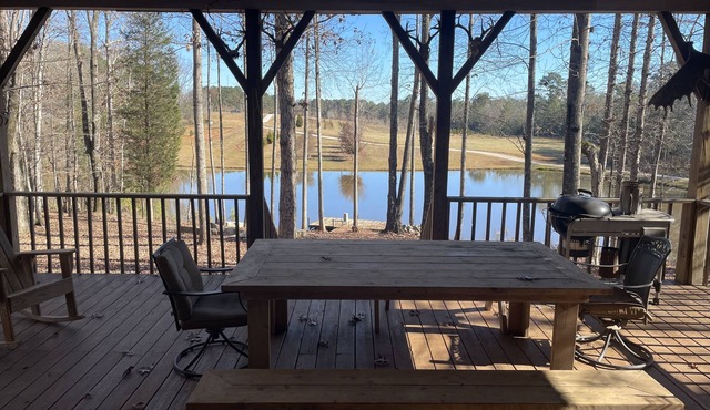 Secluded & Private Cabin situated over stocked pond.