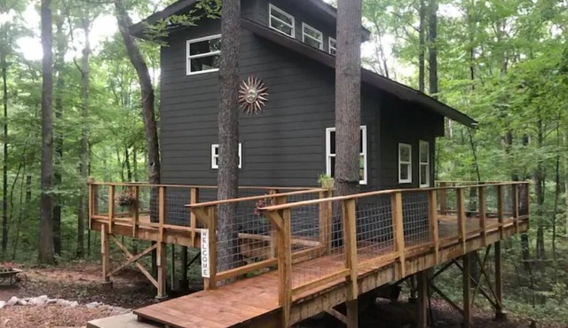 Secluded treehouse with indoor fireplace