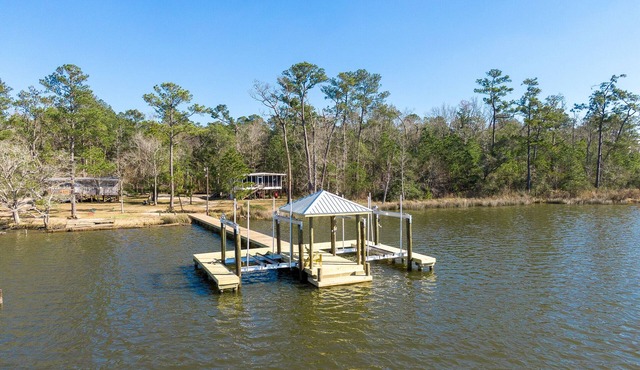 Secluded waterfront fishing cabin, boat dock, pier, sunsets, boat to beach