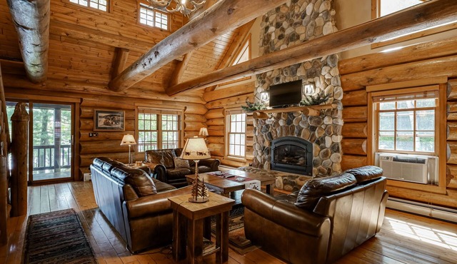 Secluded waterfront log cabin with game room, dock, fire pit & deck