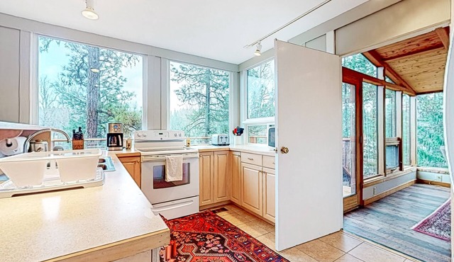 Secluded wilderness retreat with river views, wood stove, & grill - dog-friendly