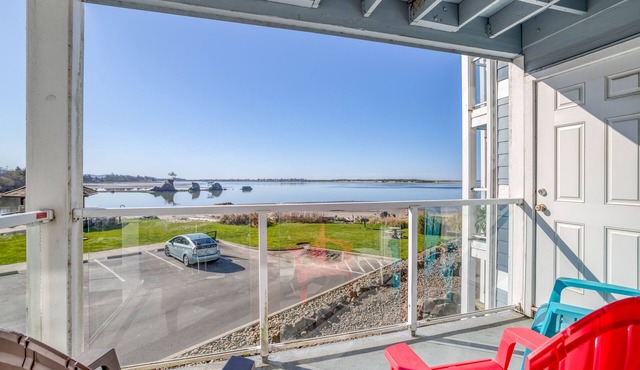 Second-Story Views of the Pacific and Siletz Bay in this Waters Edge Condo