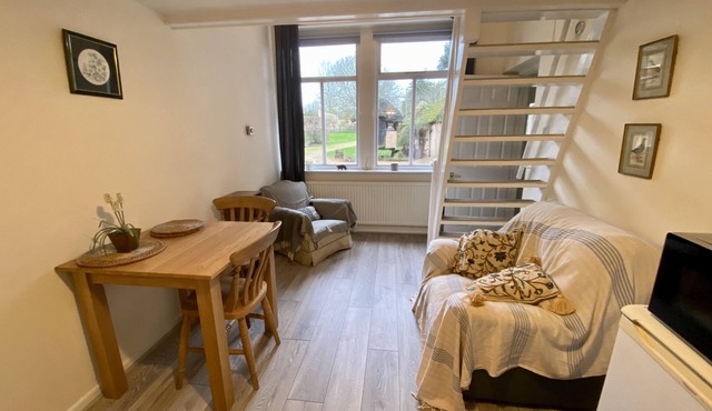 Self-catering, galleried studio cottage with parking outside