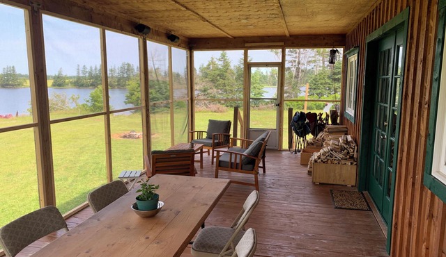Semi-private beach, huge screened in deck, woods on fenced in property.