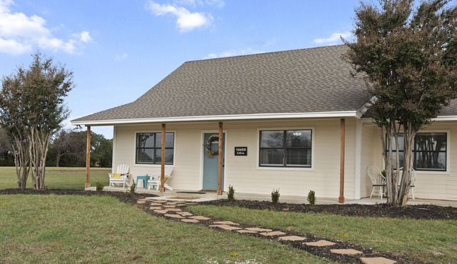 Serene farmhouse on 2 acres, perfect for family gatherings or wedding stays.