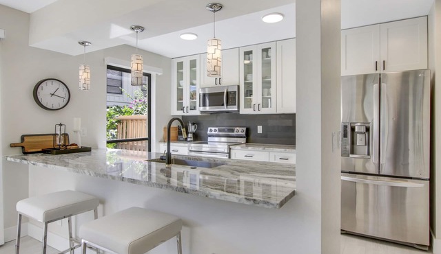 Serene Water-View Retreat with Wraparound Lanai & Elegant Renovations