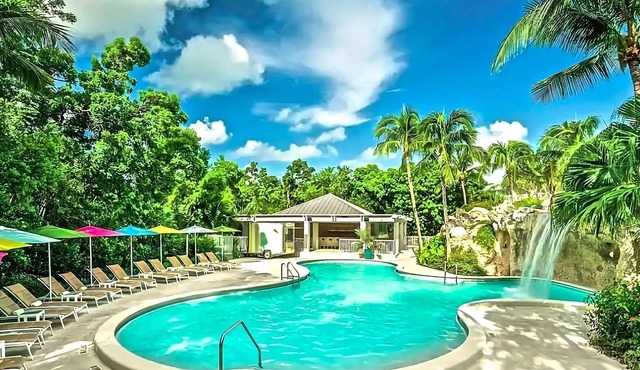 Settle into comfort in our Waterfront Room in the Hammock Wing, featuring two qu