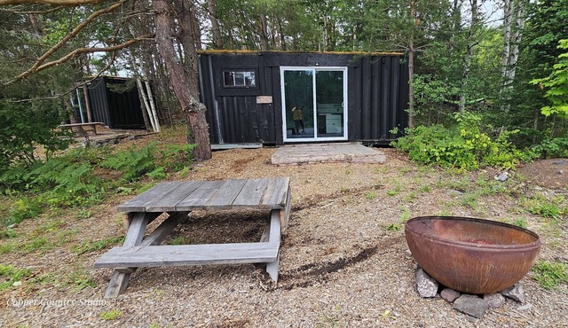 Shipping contain conversion into cozy copper Country cabin!!
