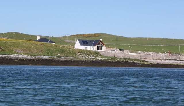 Shore Cottage -The sea and the sky become one in this gem of a cottage.