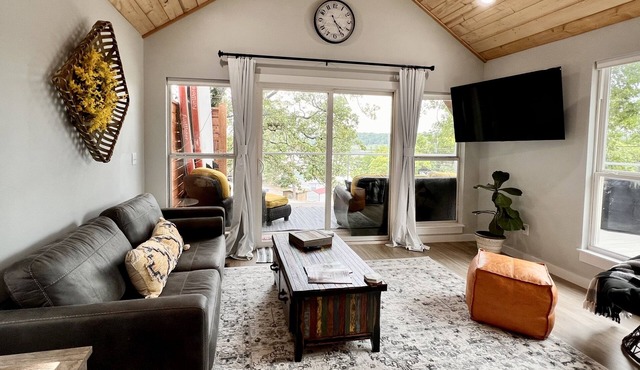 SHORT WALK TO WATER & NESTLED IN THE TREES THIS BEAUTIFUL CABIN HAS LAKE VIEWS
