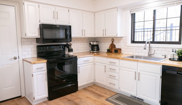 Side by side duplex w/ private driveway, yard and easy access to everything