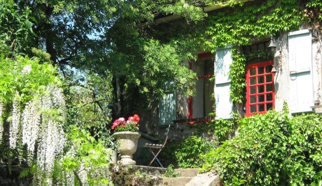 Simple stone farmhouse and garden in 12th century village