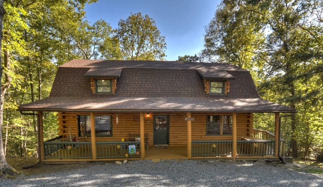 Simpler Times is a real log cabin with kids game room and firepit.