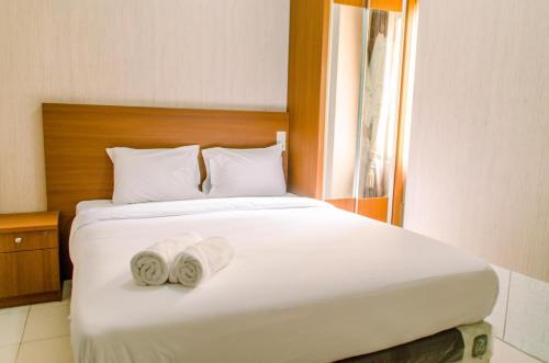 Simply and Cozy Pool View 2BR at Great Western Apartment By Travelio