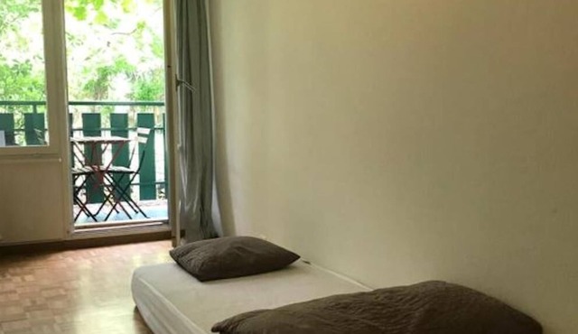 single bed in a 20 m2 room shared by 2