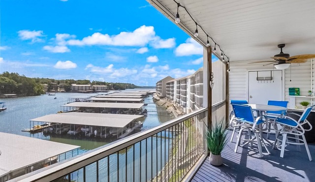 Single-level lake-view condo with dock, outdoor pool, washer/dryer, & central AC