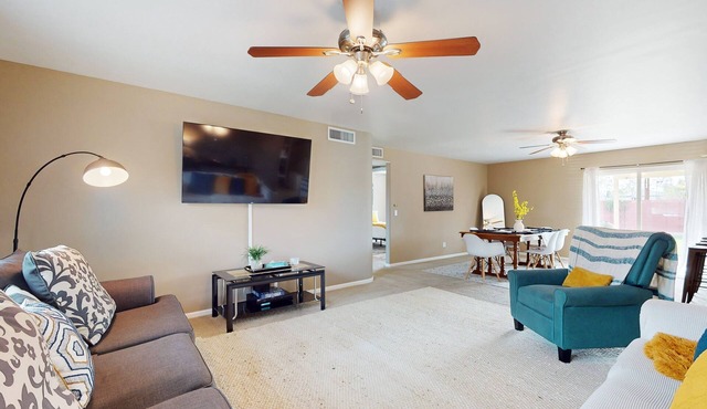 Single-level vacation home with fenced yard, furnished patio, & washer/dryer