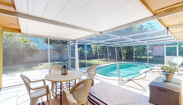 Single story home near beach with heated private pool enclosed yard Dogs ok