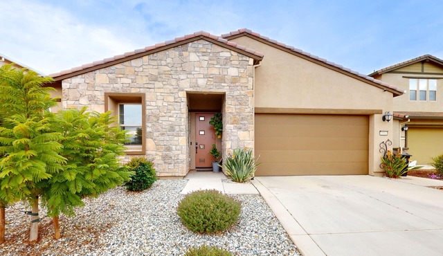 Single-story home with private patio, grill, AC, W/D, & central location