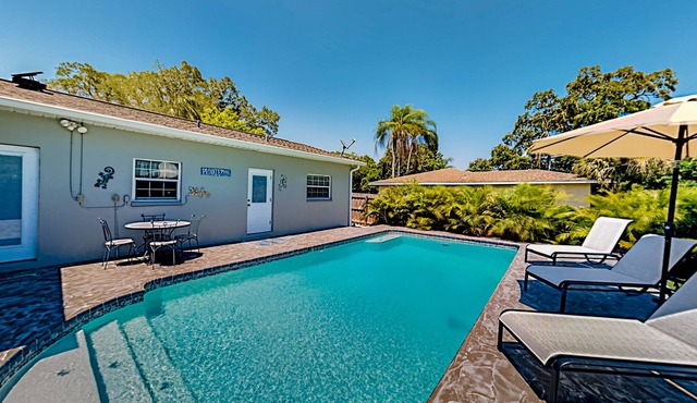 Single-story home with outdoor dining, firepit, home office & laundry room