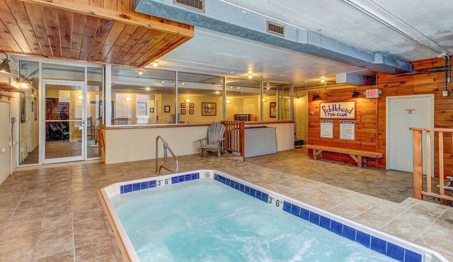 Ski-in/out condo with pool, hot tub, game room, mountain view, & fireplace
